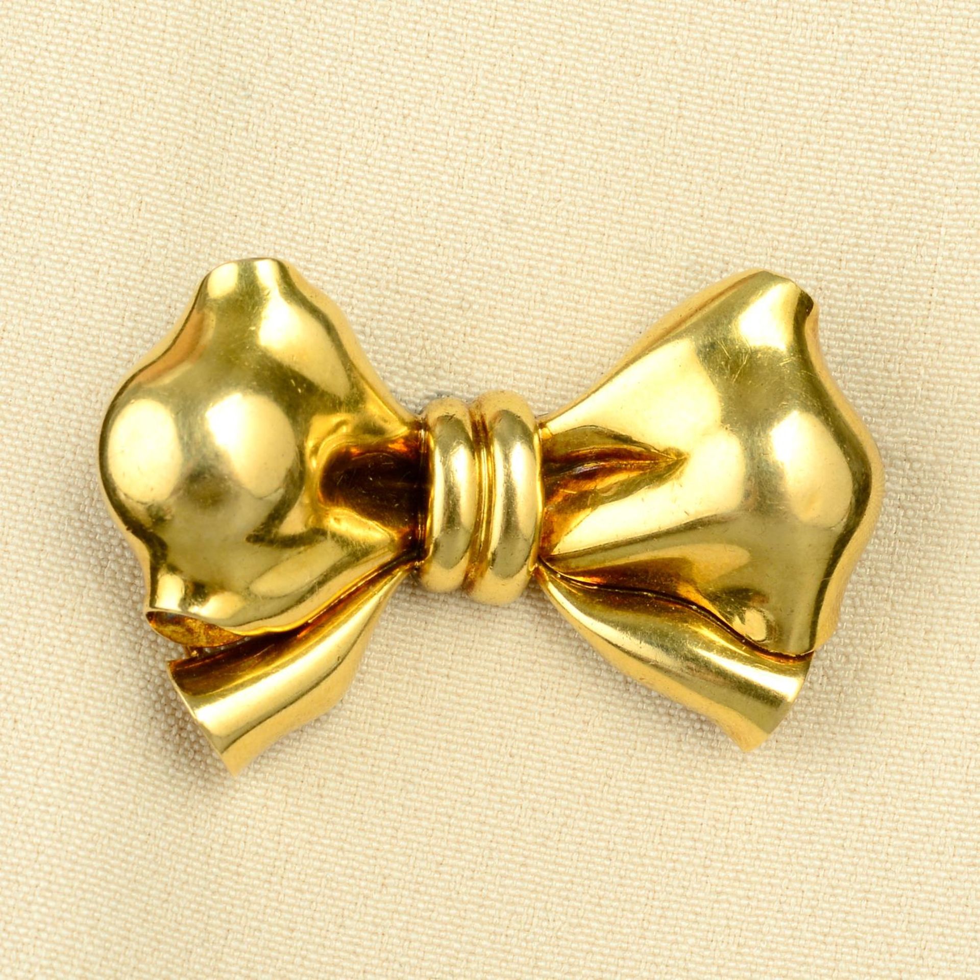 A mid 20th century gold bow brooch, by Bulgari.