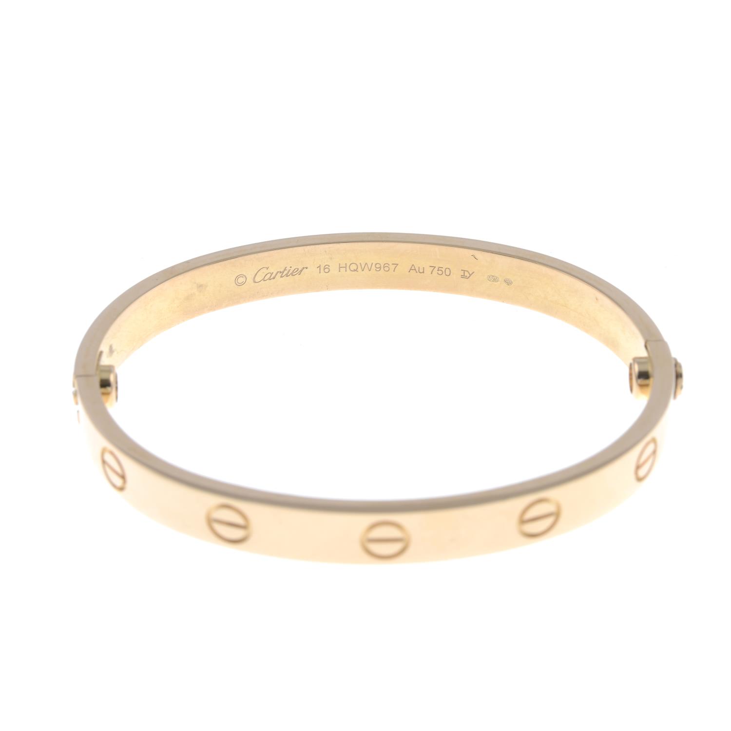 An 18ct gold 'Love' bangle, by Cartier.Swiss convention marks. - Image 3 of 4