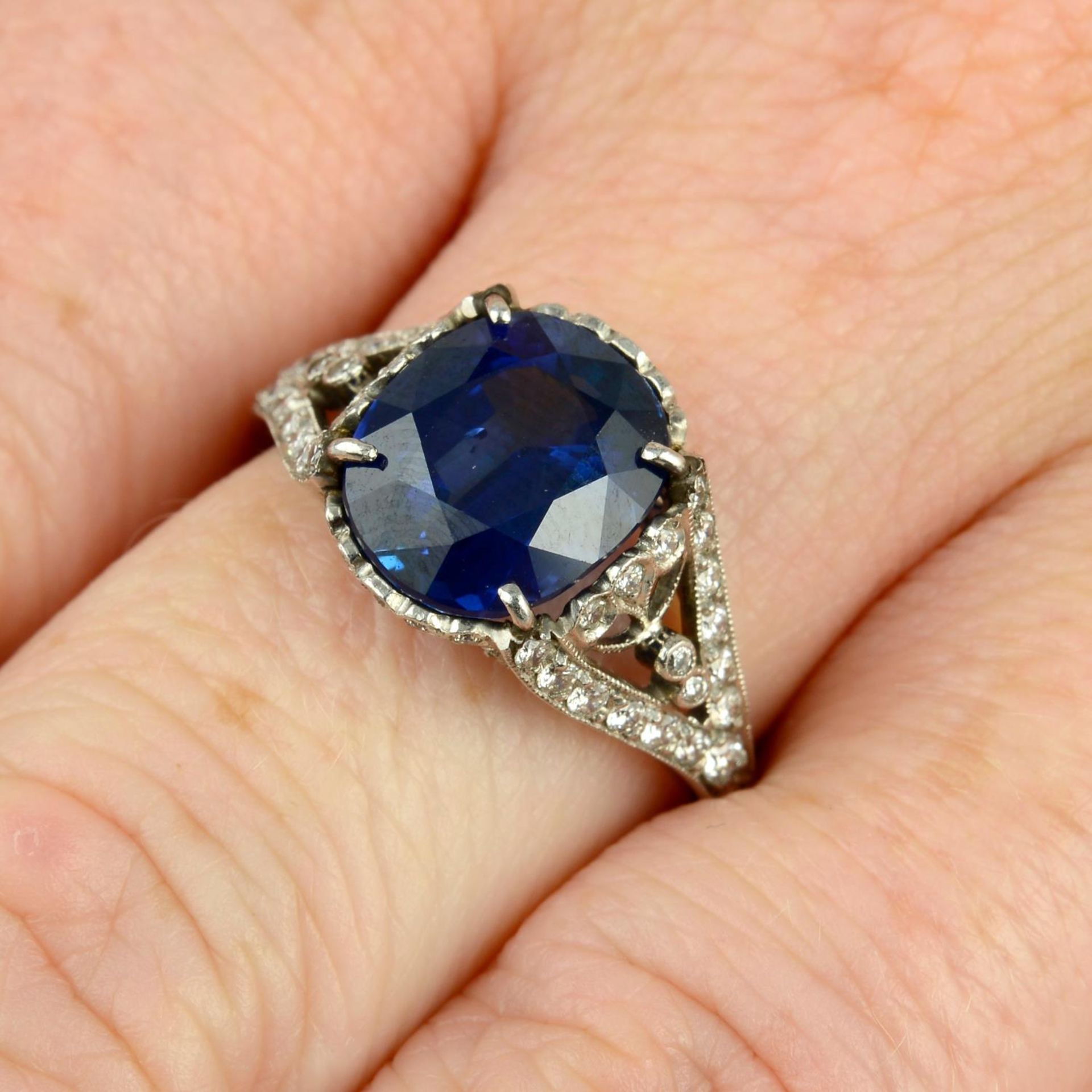 A sapphire and diamond dress ring.