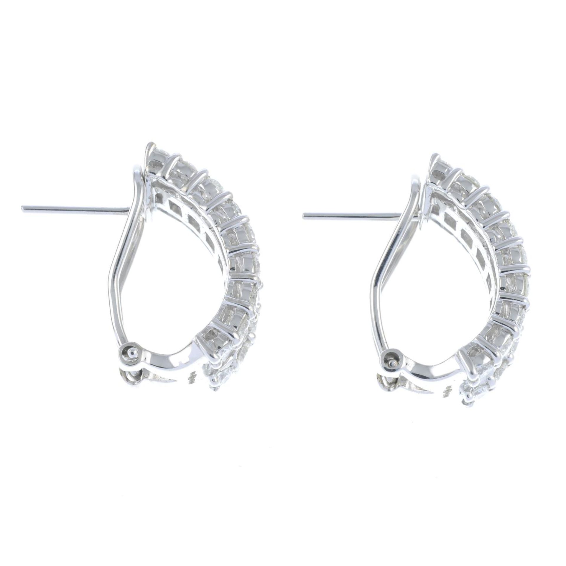A pair of 18ct gold baguette and brilliant-cut diamond half hoop earrings.Total diamond weight - Bild 3 aus 3