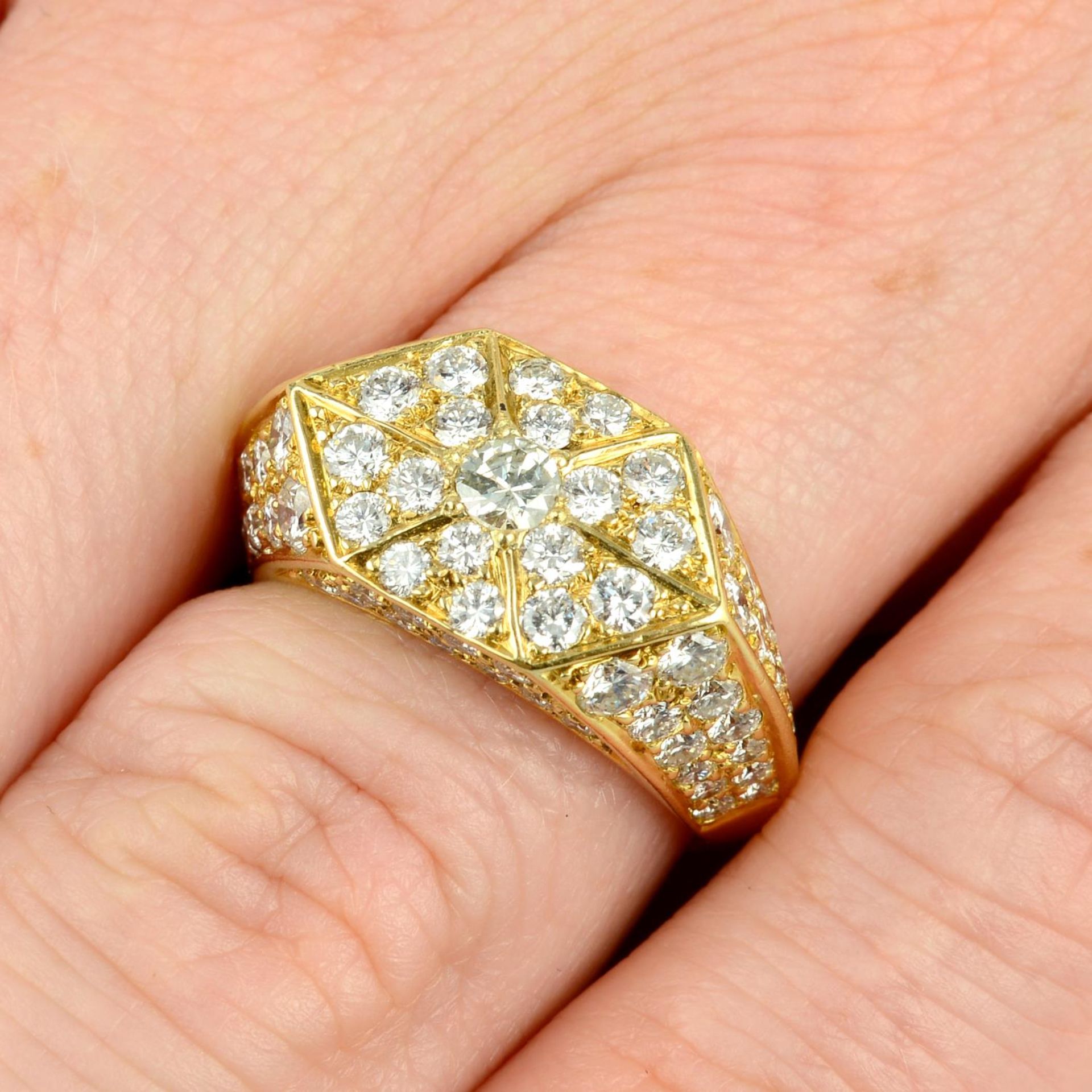 A pave-set diamond geometric dress ring.