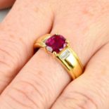 An 18ct gold Thai ruby single-stone ring, with baguette-cut diamond sides.