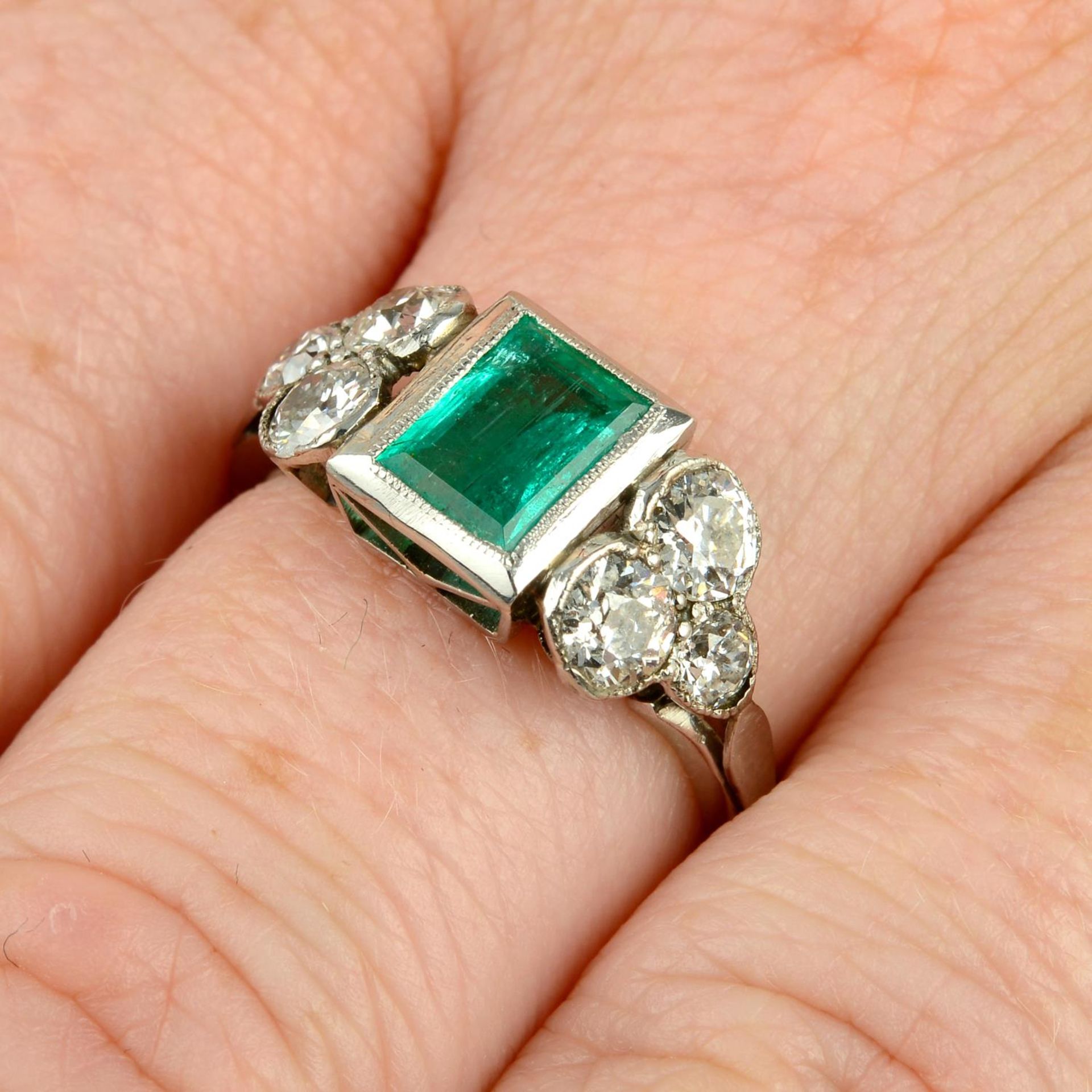 An emerald and old-cut diamond ring.Emerald calculated weight 0.77ct,