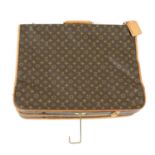 LOUIS VUITTON - a portable Monogram Bandoulière garment bag.