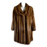 A knee-length wild mink coat.