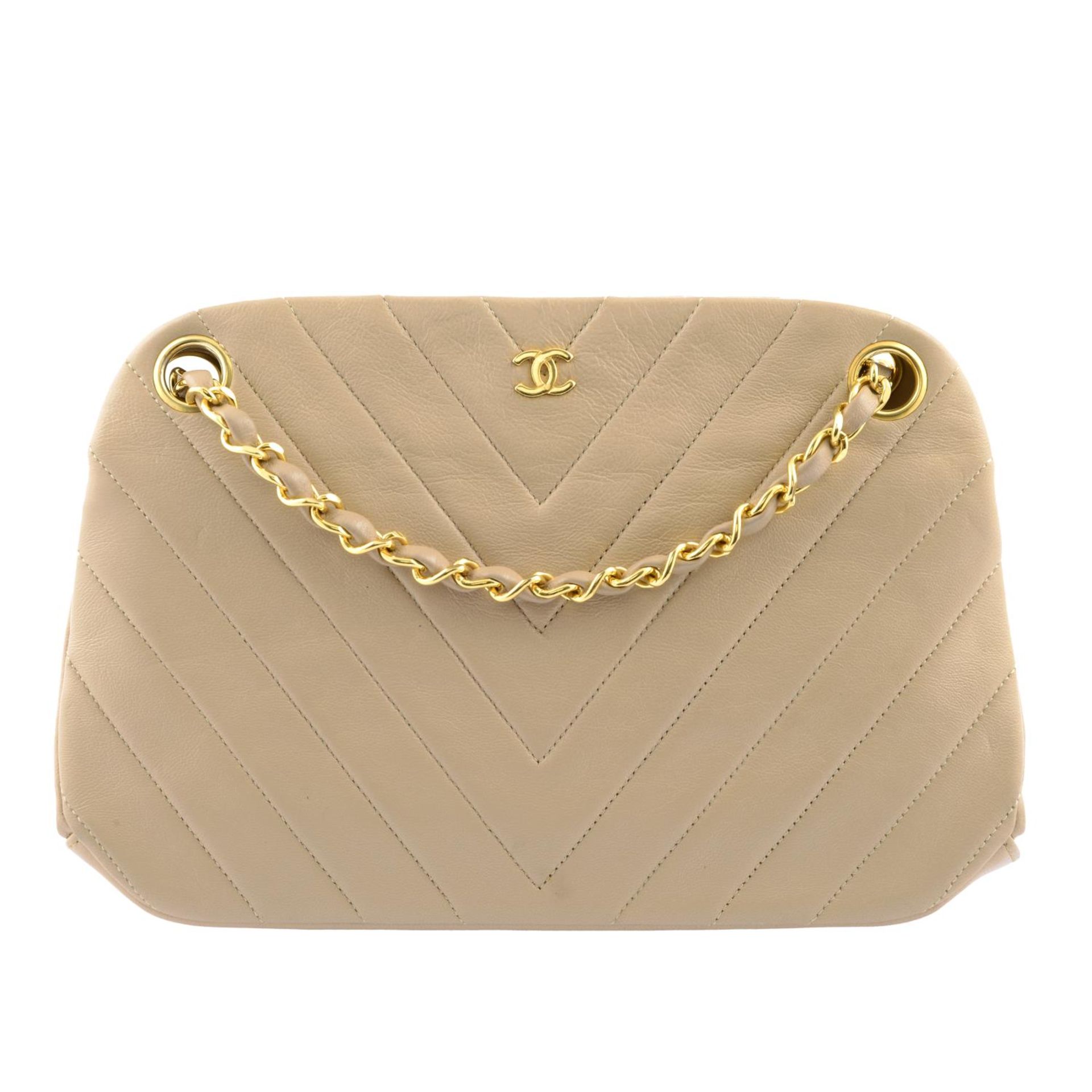 CHANEL - a chevron quilted handbag.