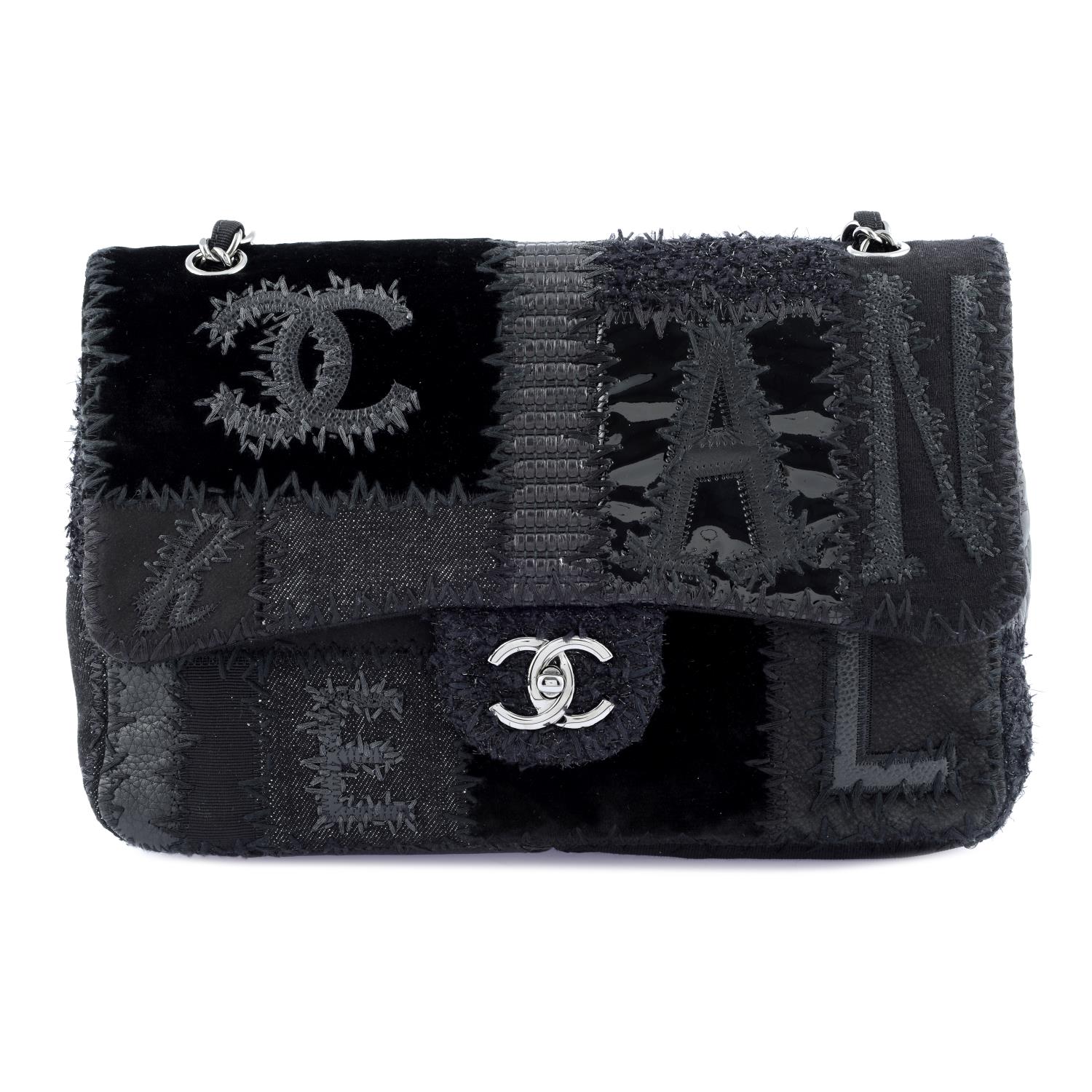 CHANEL - a black Patchwork Flap handbag.