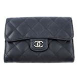 CHANEL - a quilted wallet.