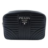 PRADA - a black quilted Diagramme Camera crossbody handbag.