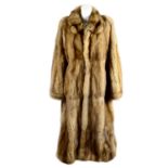 A full-length unisex golden sable coat.