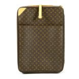 LOUIS VUITTON - a Monogram Pégase 65 rolling suitcase.