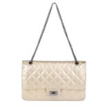 CHANEL - a metallic gold quilted 2.55 Reissue Flap 227 handbag.