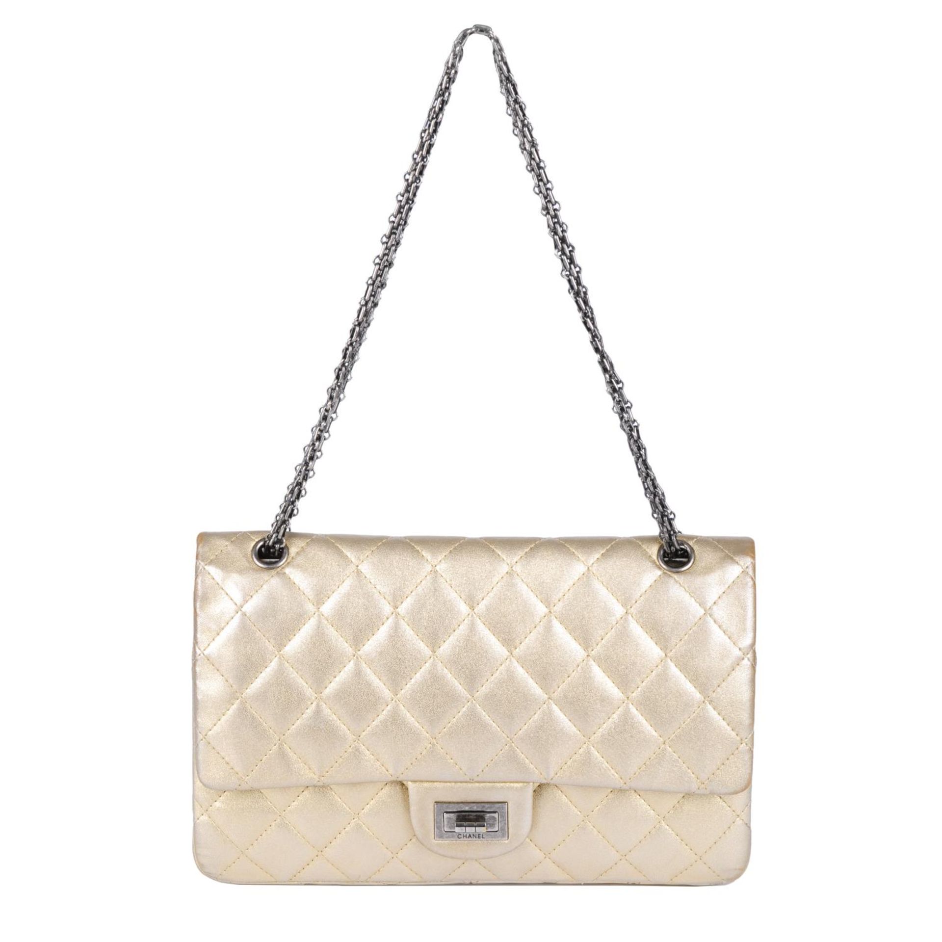 CHANEL - a metallic gold quilted 2.55 Reissue Flap 227 handbag.