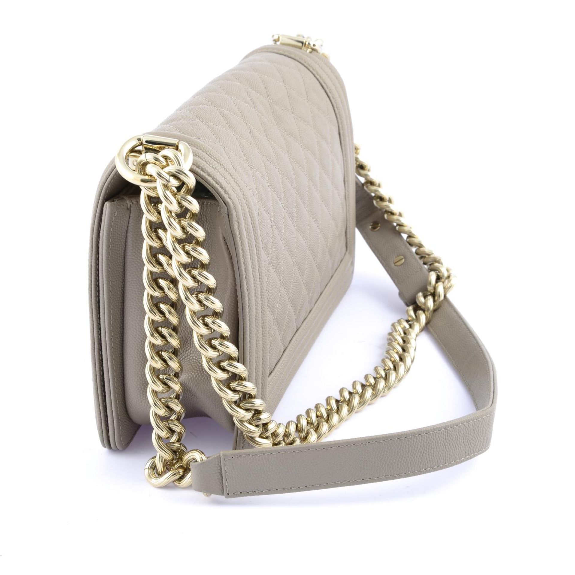 CHANEL - a Medium Shiny Beige Caviar Boy Flap handbag. - Bild 2 aus 5