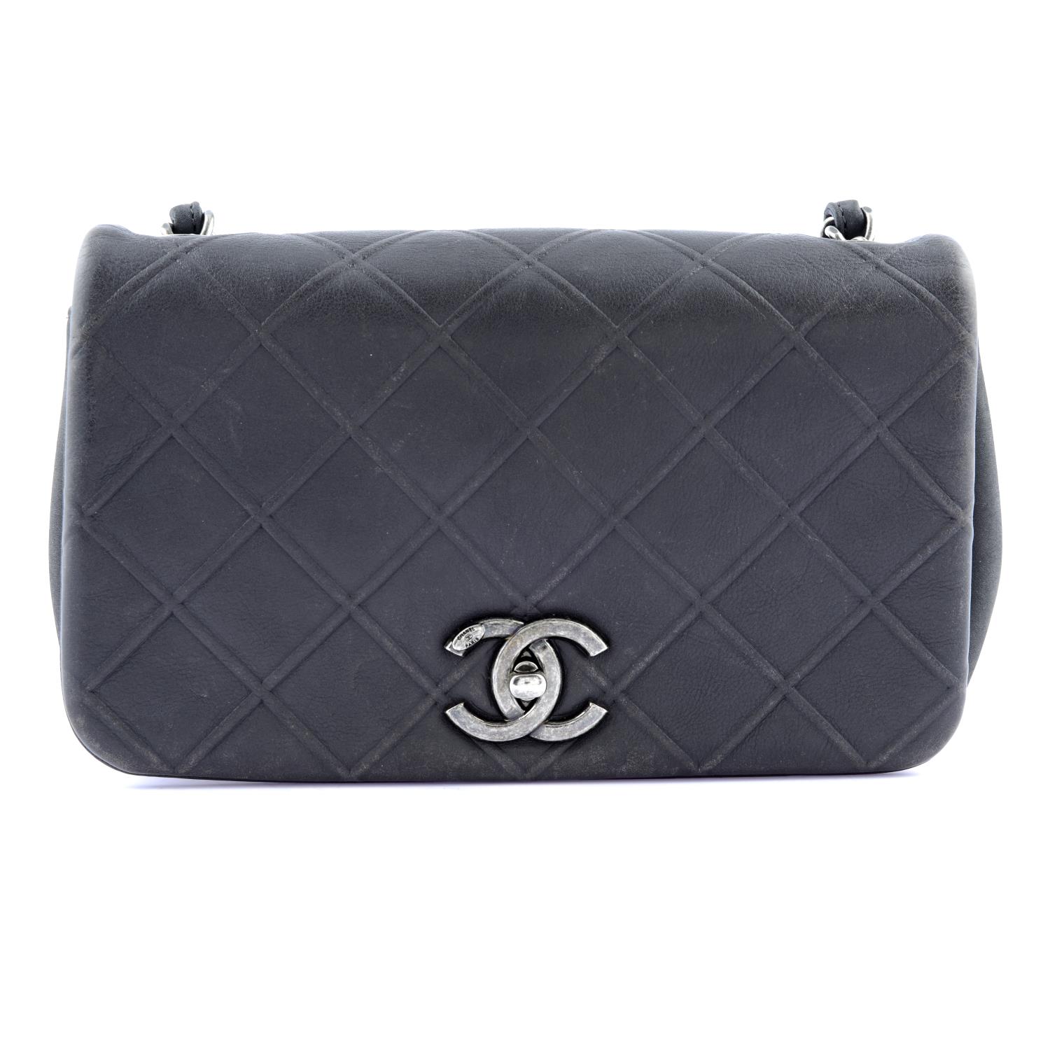 CHANEL - a small grey handbag.