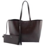 YVES SAINT LAURENT - a large perforated tote handbag.