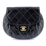 CHANEL - a small glazed calfskin handbag.