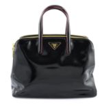 PRADA - a black patent leather Spazzolato Double Zip handbag.