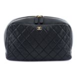 CHANEL - a Curvy Pouch Cosmetic Case.