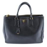 PRADA - a black Saffiano Galleria handbag.