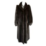 A full-length dark ranch mink coat.