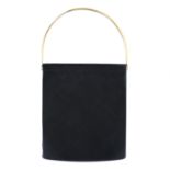 CARTIER - a tall black Trinity handbag.