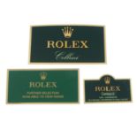 ROLEX - a group of three metal watch display signs,