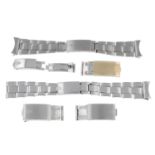 ROLEX - a group of seven assorted stainless steel bracelets and clasps.