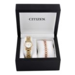 A group of boxed watches, to include examples by Guess and Citizen.