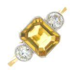 A yellow sapphire and brilliant-cut diamond three-stone ring.Sapphire weight 1.25cts.Total diamond