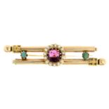 An early 20th century gem-set brooch.Gems to include garnet, split pearl and turquoise.