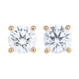 A pair of 18ct gold brilliant-cut diamond single-stone stud earrings.Estimated total diamond weight