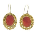 A pair of mid to late 19th century coral cameo earrings.Length 3.4cms.