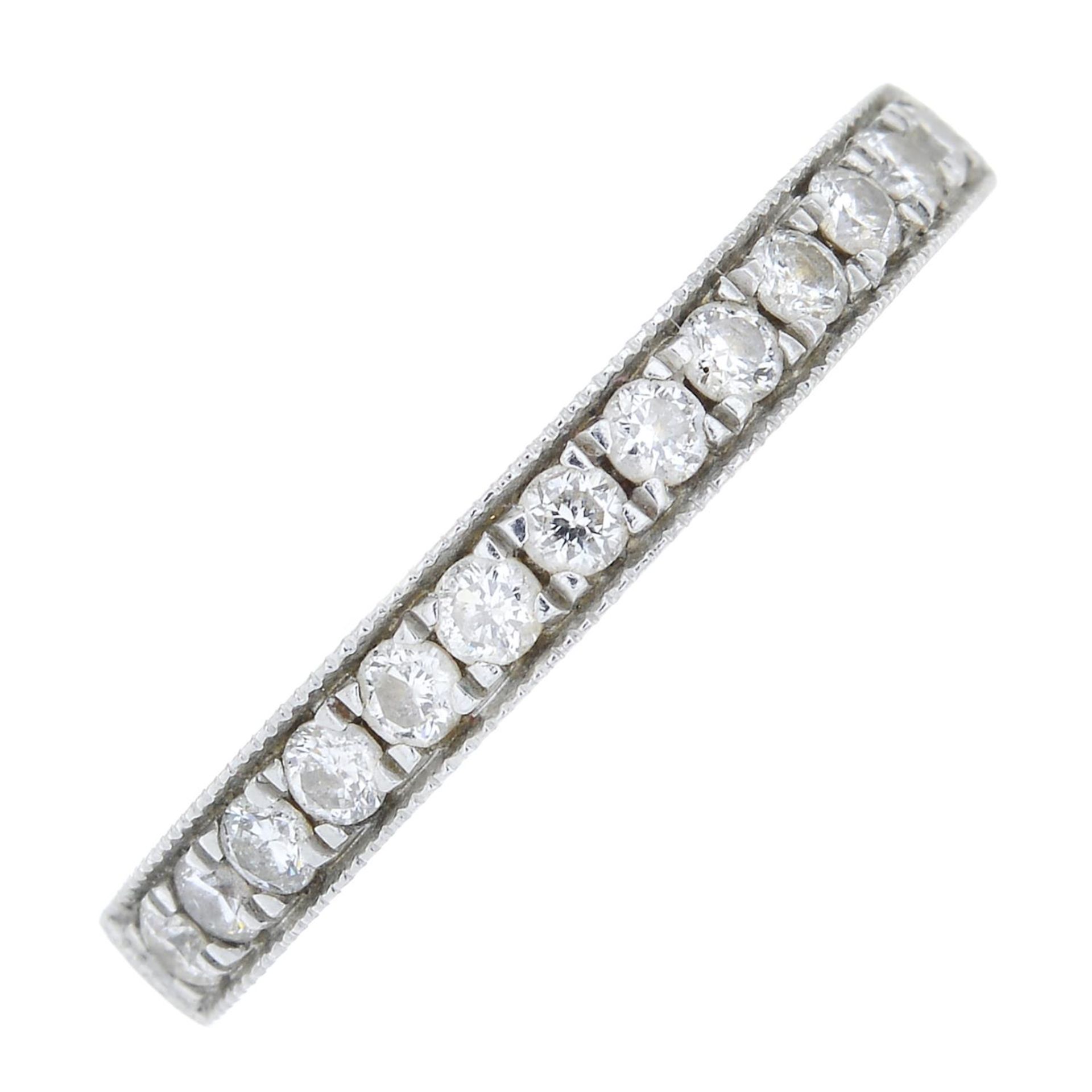 A platinum brilliant-cut diamond half eternity ring.Estimated total diamond weight 0.25ct.Hallmarks