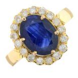 A sapphire and brilliant-cut diamond cluster ring.Sapphire calculated weight 2.99cts,