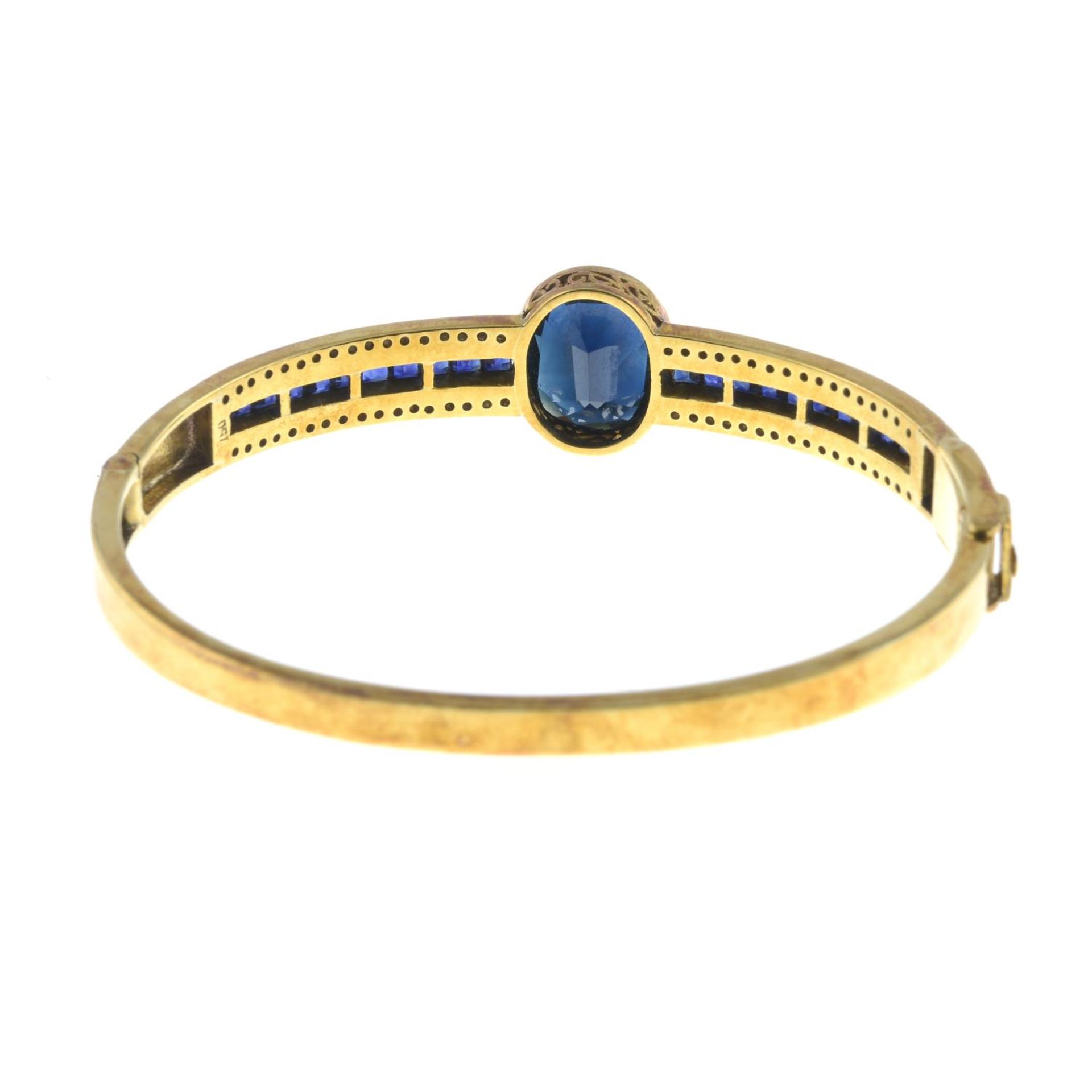 A sapphire and brilliant-cut diamond bangle. - Image 2 of 2