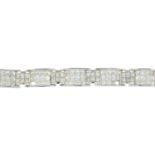 An 18ct gold square-shape diamond bracelet.Three diamonds deficient.Estimated total diamond weight