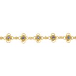 A sapphire cabochon floral bracelet.Possible French marks, indistinct.Length 17cms.