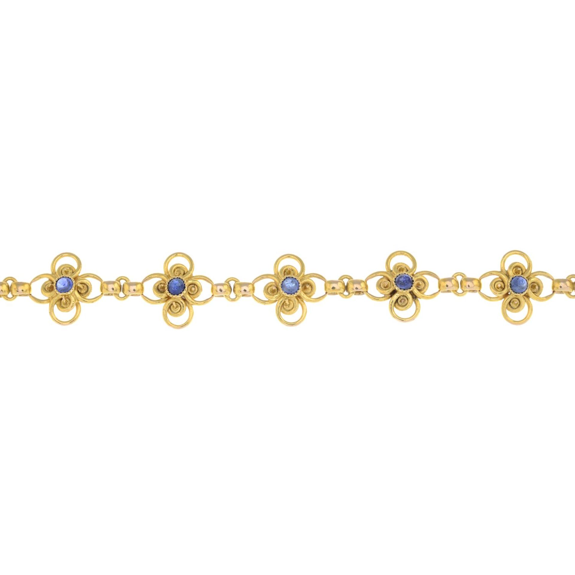 A sapphire cabochon floral bracelet.Possible French marks, indistinct.Length 17cms.