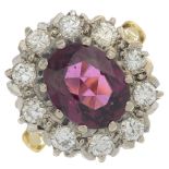 An 18ct gold garnet and brilliant-cut diamond cluster ring.Approximate dimensions of garnet 10 by