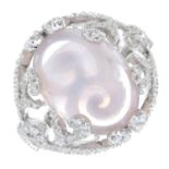 An 18ct gold rose quartz cabochon and brilliant-cut diamond dress ring.Rose quartz weight