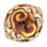 An 18ct gold citrine and brilliant-cut diamond dress ring.Citrine calculated weight 8.19cts,