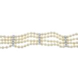 A cultured pearl and vari-cut diamond bracelet.Approximate dimensions of one cultured pearl 4.5mms.