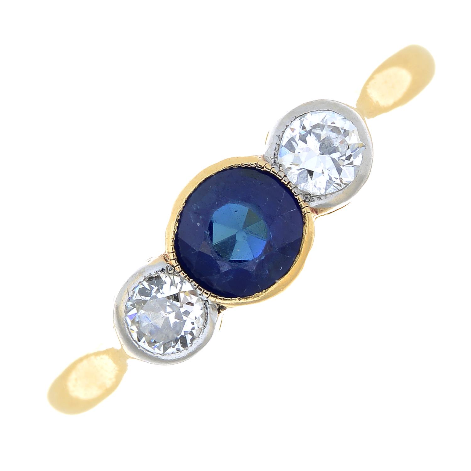 An early 20th century 18ct gold sapphire and circular-cut diamond three-stone ring.Estimated total