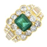 A vari-cut diamond and emerald dress ring.Emerald calculated weight 1.01cts,