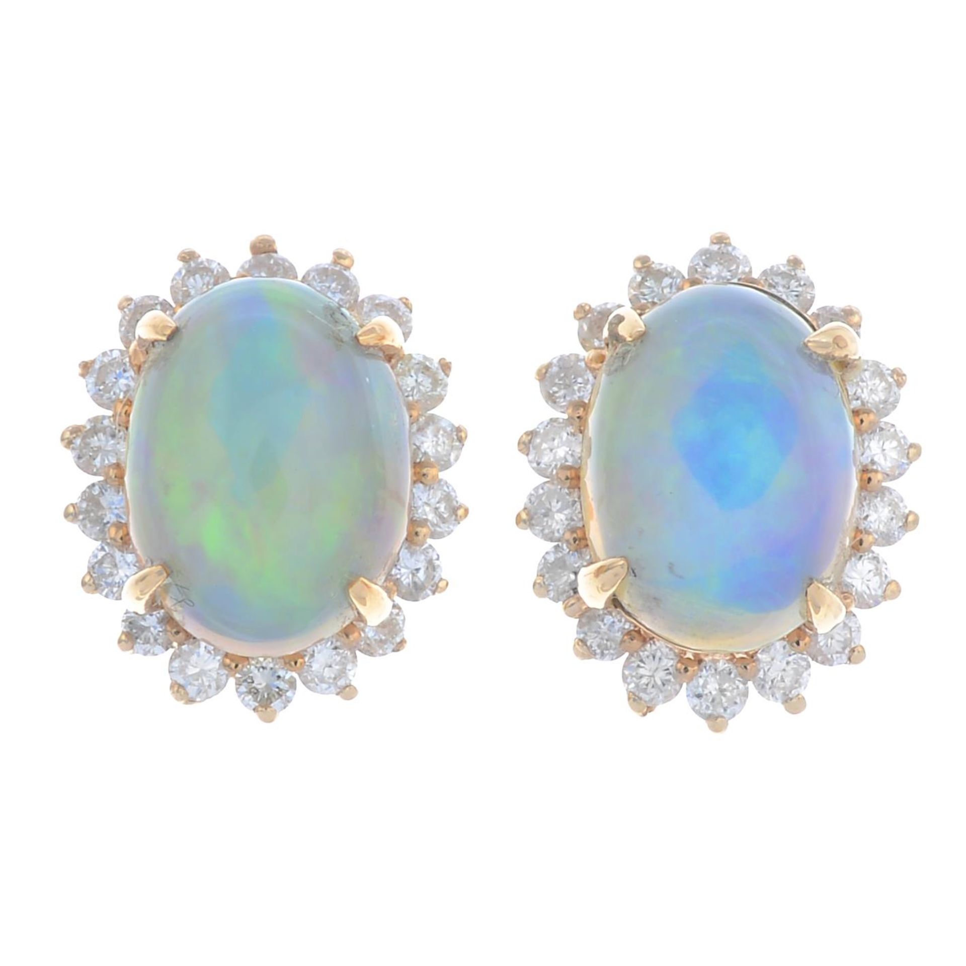 A pair of 18ct gold opal and brilliant-cut diamond cluster earrings.Total opal weight 0.96ct,