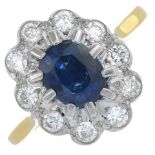 An 18ct gold sapphire and brilliant-cut diamond cluster ring.Sapphire calculated weight 0.87ct,