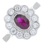 An 18ct gold ruby and brilliant-cut diamond cluster ring.Ruby calculated weight 0.77ct,
