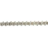 A brilliant-cut diamond bracelet.Estimated total diamond weight 3.50cts,