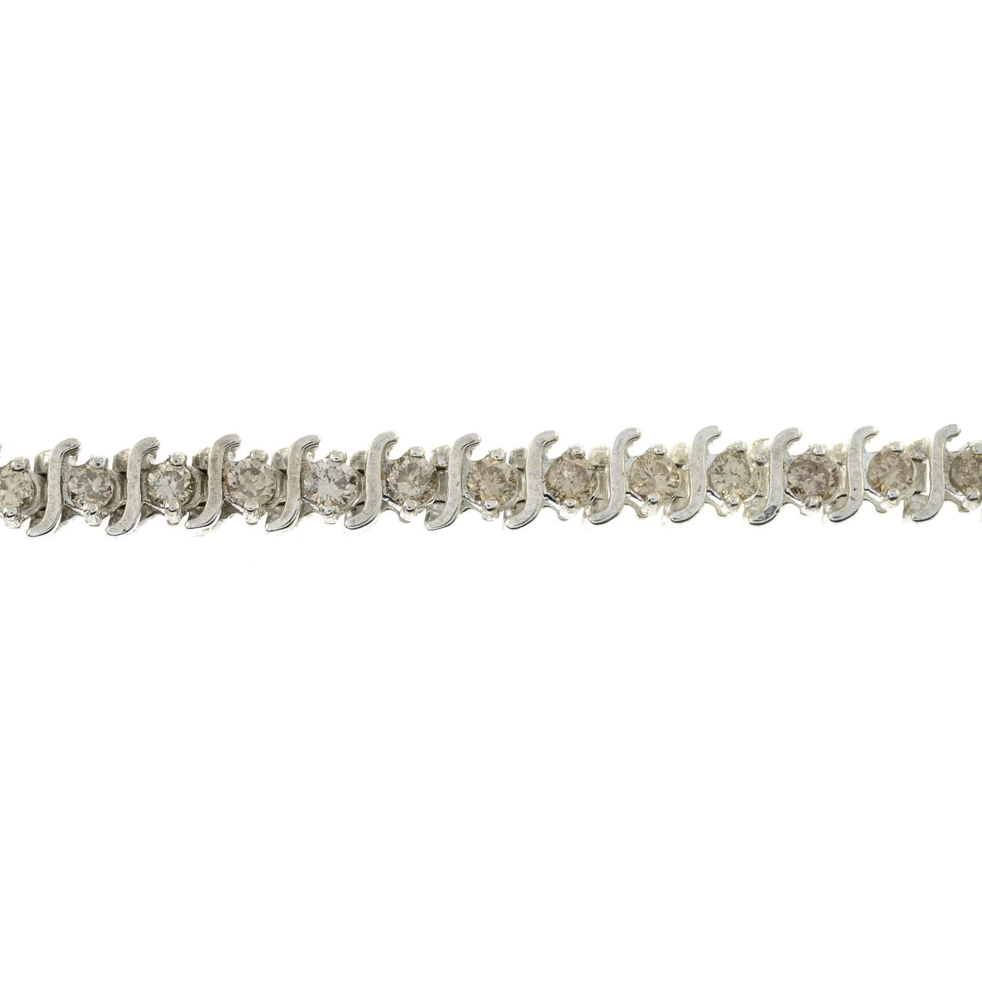 A brilliant-cut diamond bracelet.Estimated total diamond weight 3.50cts,